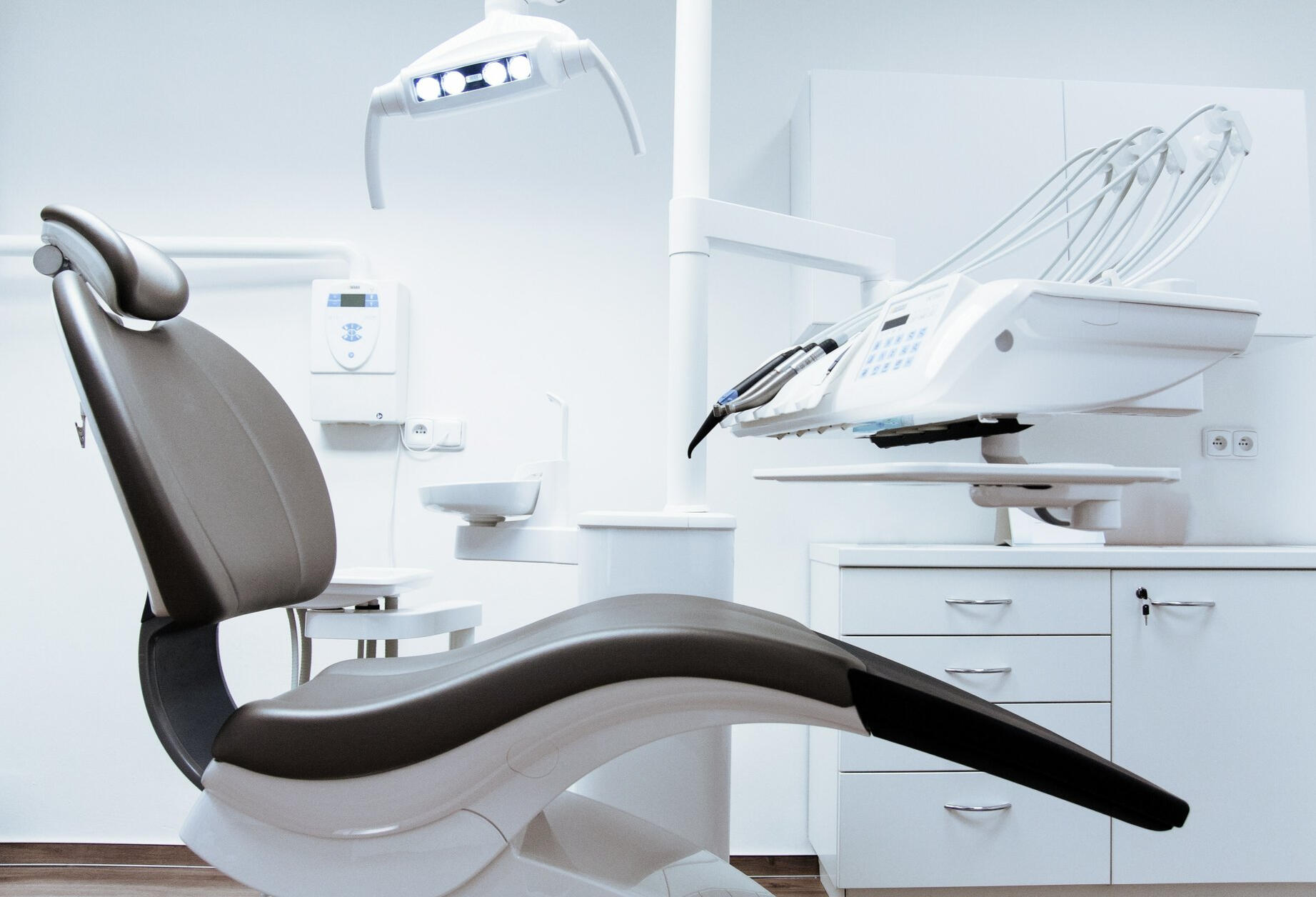 dental chair and equipment at dentist office very clean shows the importance of having clean space in dental or medical office